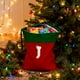 thumbnail image 1 of Bolsa de regalo navideña con cordón, 26 letras, poliéster rojo, 30 x 38 cm | Bolsa reutilizable para dulces navideños, pequeña bolsa para envolver regalos, organizador de decoración festiva, 1 of 6