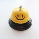 thumbnail image 1 of Campana de mano con forma de cara sonriente de metal para entrenamiento de mascotas, barra de servicio para restaurante, campana de convocatoria, contestador automático de competición, mesa de, 1 of 6