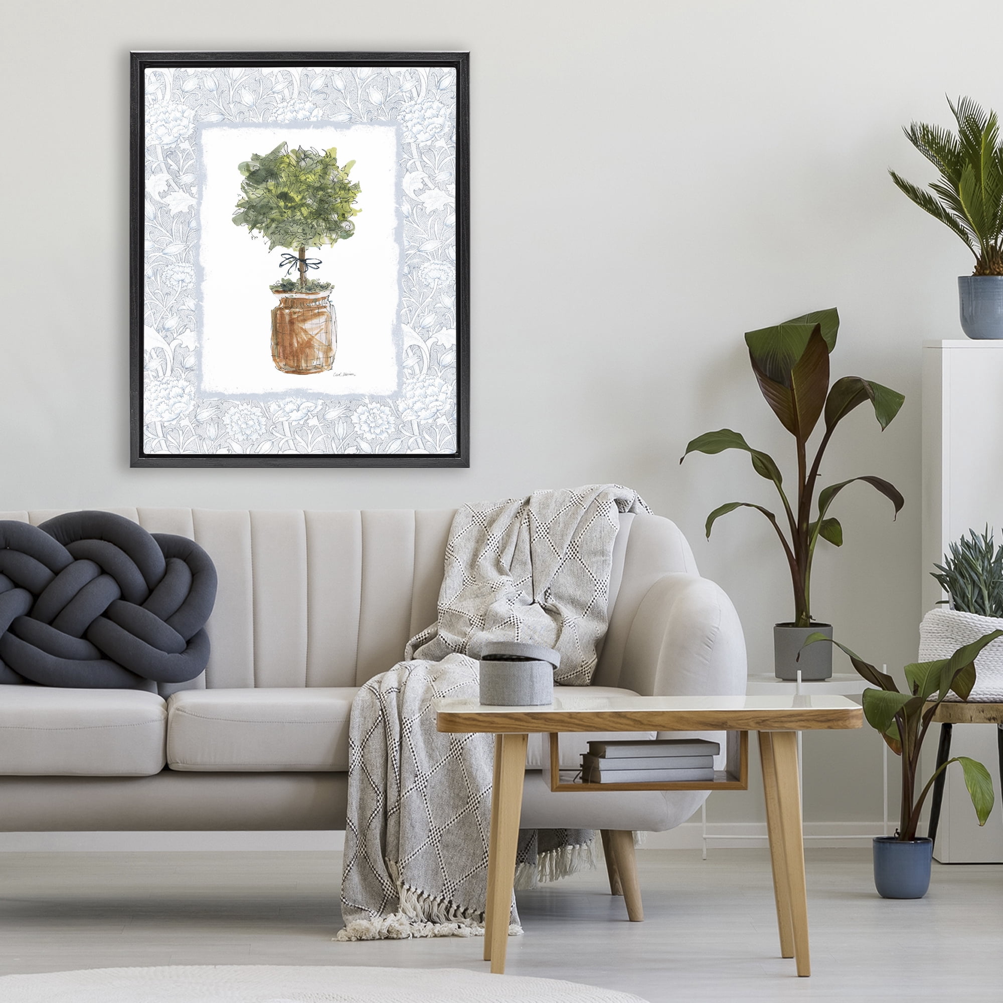 Stupell Industries Potted Topiary with Ribbon Black Framed Floater Canvas Wall Art, design by Carol Robinson