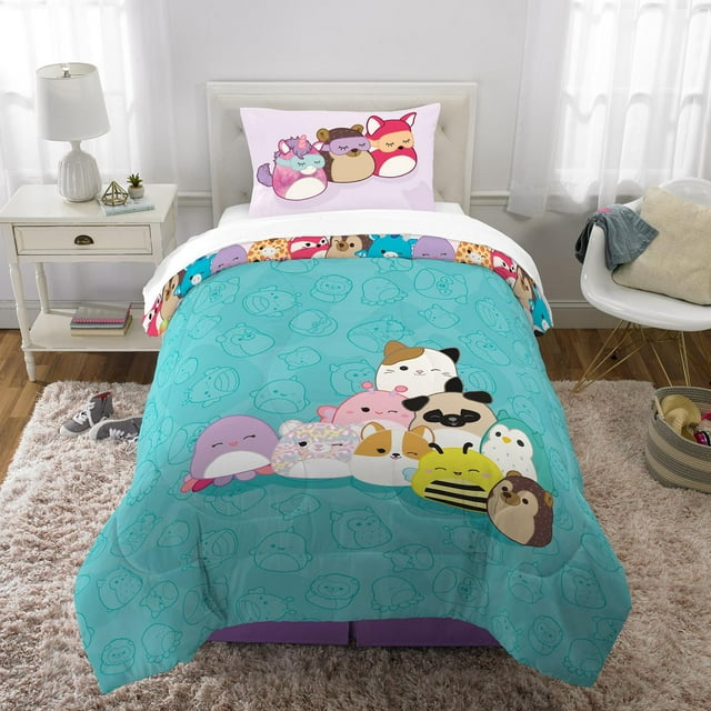 Squishmallows Mallow Dreams twin/full comforter and pillowcase set with various cute Squishmallows characters on teal bedding in a bright bedroom.