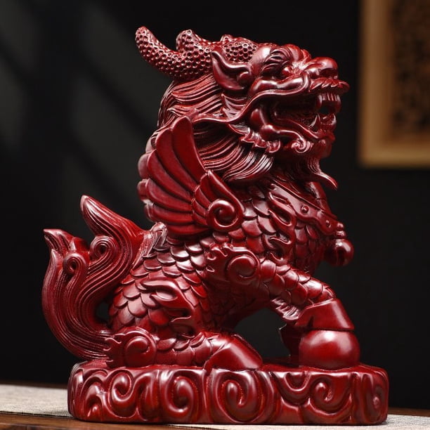 Large red Qilin figurine, made of wood, featuring male and female fire Qilin, carved from rosewood, a solid wood home feng shui decoration.