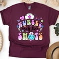 thumbnail image 1 of Nurses Call The Shots T-Shirt | Funny Nurse Graphic Tee with Syringe Design, Maroon, Size L, 1 of 6