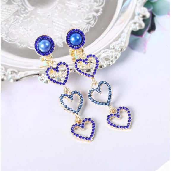 Clip on 2 1/4" gold, blue pearl and stone dangle three heart earrings