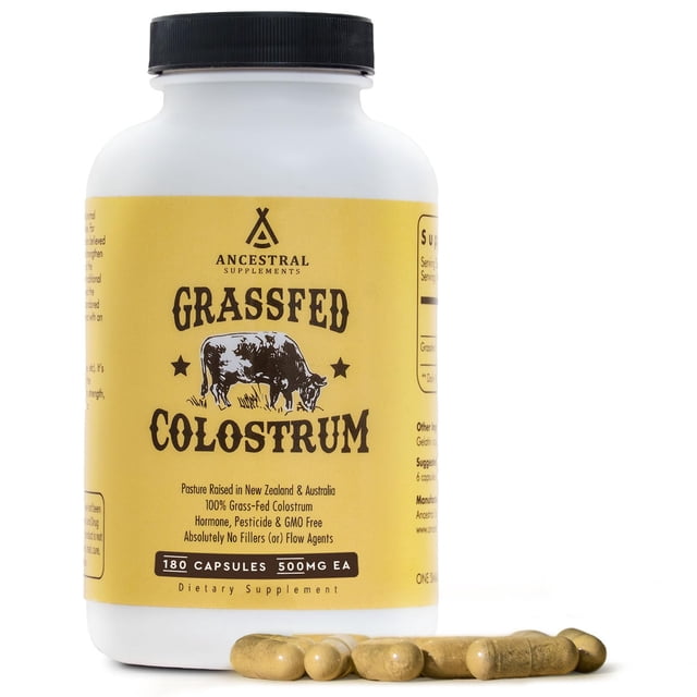 suplemento ancestral supplements, calostro de res alimentado con pasto, 3000 mg Vista frontal de frasco blanco con etiqueta amarilla y logotipo Ancestral Supplements que dice 'Grassfed Colostrum'; tapa negra y seis cápsulas beige frente a fondo blanco; etiqueta muestra '180 cápsulas' y origen Nueva Zelanda/Australia; indicado como calostro bovino en cápsulas para salud intestinal e inmunidad, y a menudo usado para apoyar la nutrición deportiva.