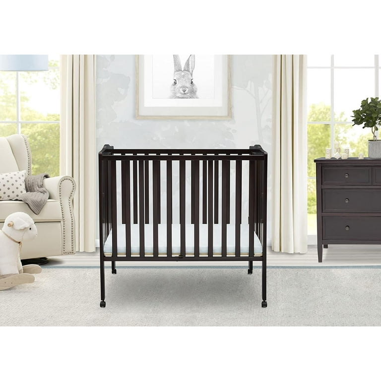 Delta children folding sales portable mini baby crib
