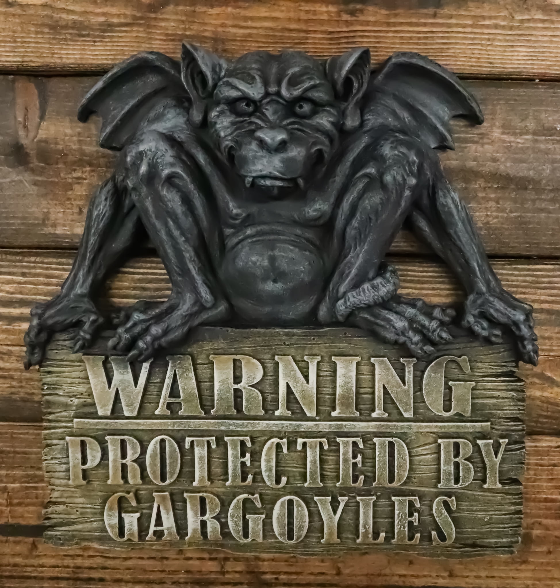 Gothic Winged Gargoyle On Warning Protected By Gargoyles Sign Wall