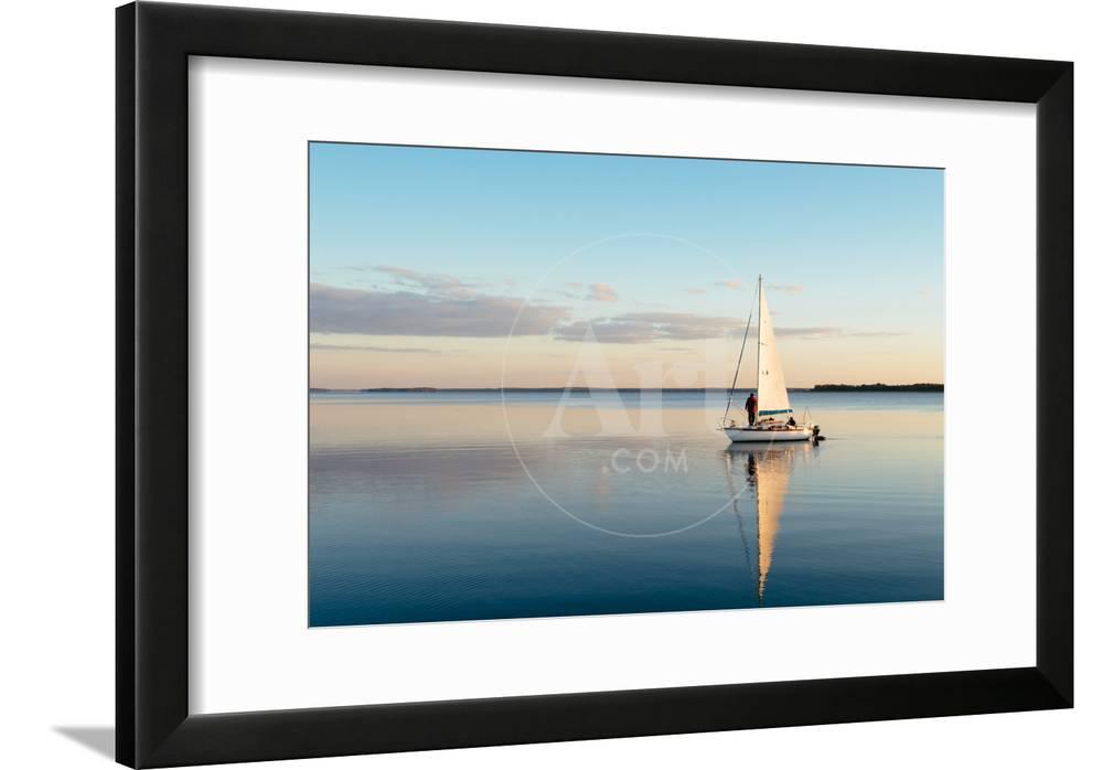 Sailing Boat on a Calm Lake with Reflection in the Water Serene Scene ...