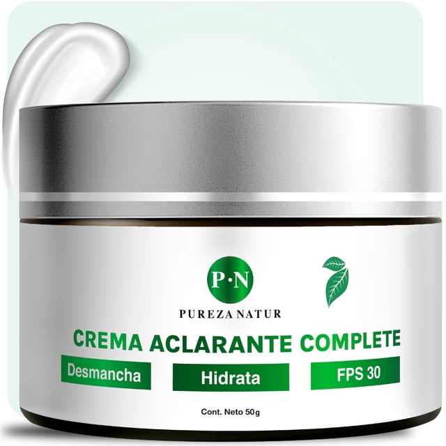 pureza natur crema facial aclarante para paño en cara y cuerpo | humecta y aclara la piel desvanece arrugas y repara cutis face repair Frasco frontal de 50 g con tapa plateada; etiqueta blanca y logo verde P·N, texto verde "CREMA ACLARANTE COMPLETE" y recuadros que indican "Desmancha", "Hidrata" y "FPS 30"; porción de crema visible en la esquina superior izquierda sobre fondo claro. También adecuada para manos y zonas corporales con manchas.
