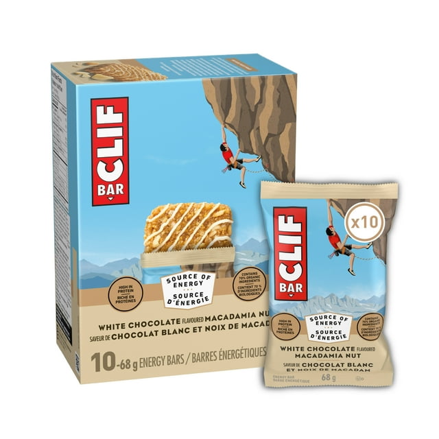 CLIF BAR Energy Bars, White Chocolate Macadamia Nut, pack of 10 bars each 68 g, featuring box and single wrapped bar with blue sky and mountain background and rock climber illustration, high in protein and 70% organic ingredients, source of energy granola bars suitable for active lifestyles and quick snacks.
