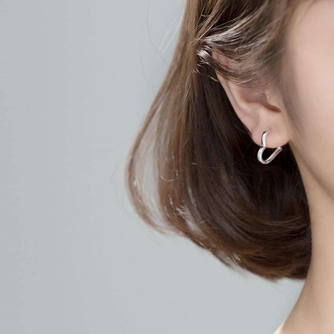 Heart earring inside ear deals