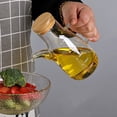 thumbnail image 4 of Aceitera de vidrio de borosilicato de 500 ml, hermética, con escala, apta para aceite, vinagre líquido y otros líquidos., 4 of 7