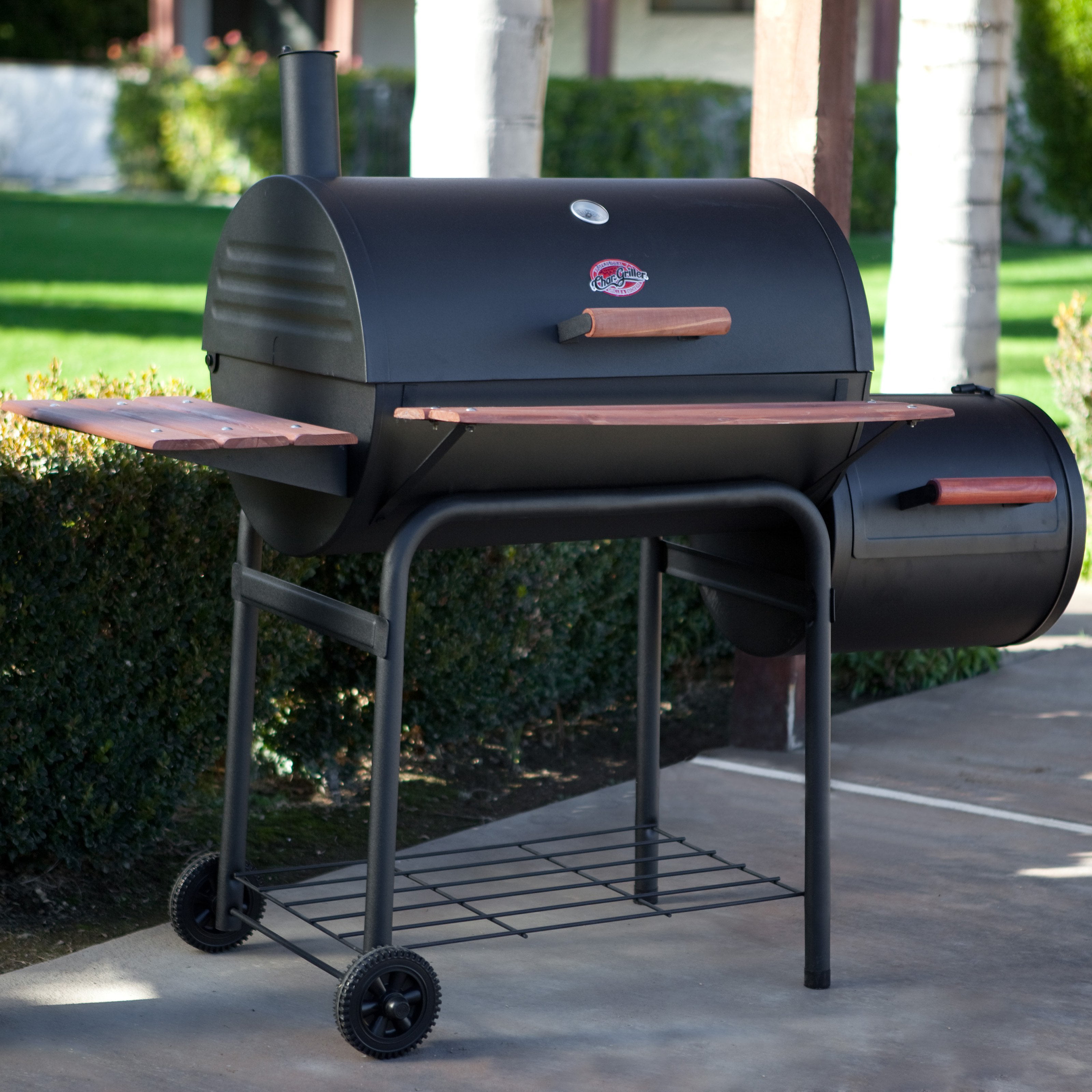 Charcoal grill with smoker box attached