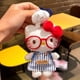 thumbnail image 1 of hello Cartoon Red Glasses Apron Keychain Plush Toy Backpack Doll Plush Keychain for Women Style 23, 1 of 1