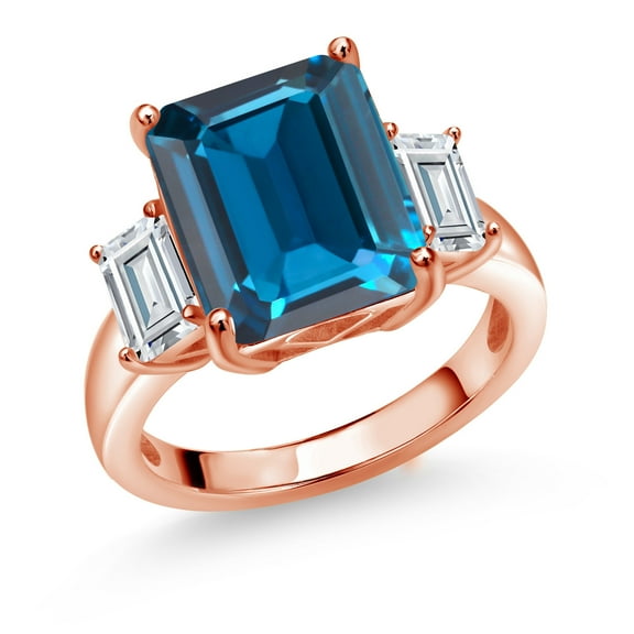 Gem Stone King 18K Rose Gold Plated Silver 3-Stone Ring Emerald Cut London Blue Topaz and Moissanite (8.64 Cttw, Size 9)