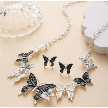 Pierced silver and gray butterfly necklace and earring set