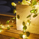 thumbnail image 1 of Cadena de luces solares de flores artificiales de 2 m y 20 LED de glicina para fiestas, bodas, jardines y habitaciones, 1 of 5