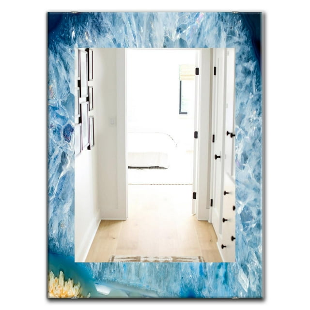 Vanity mirror with a 24x36 inch mid-century frame showcasing light blue geode crystal interior design.