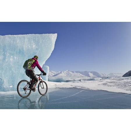 Woman Fat Tire Mountain Biking On Ice At The Knik Glacier Chugach Mountains Southcentral Alaska Winter