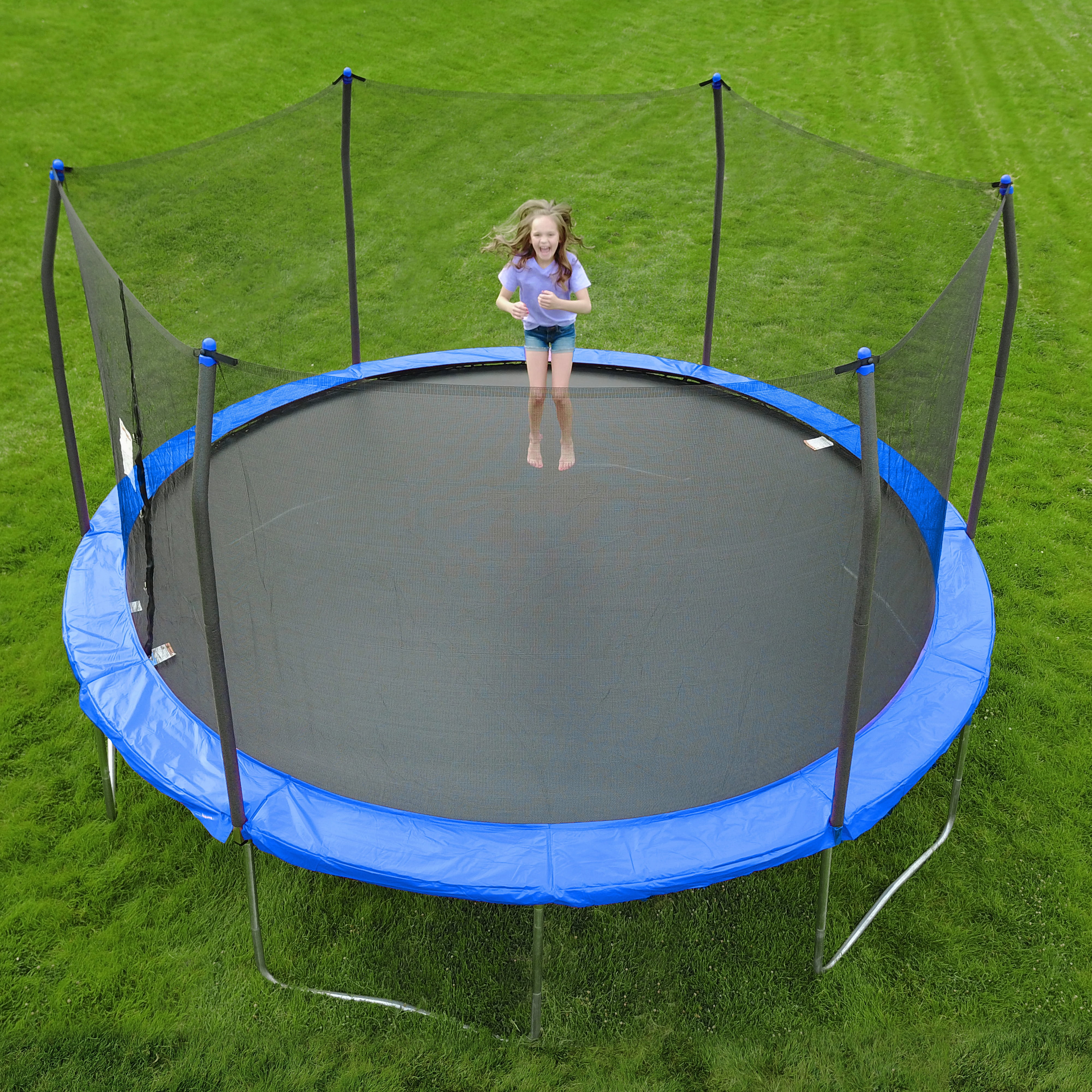 A girl jumping on Skywalker's 15 ft Trampoline.