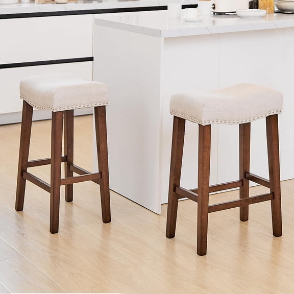 26 Inch Counter Height Saddle Bar Stools Set of 2, Beige | Backless Barstools with Padded Linen Seat, Solid Wood Frame, Footrest & Nailhead Trim, Modern Farmhouse for Kitchen Island
