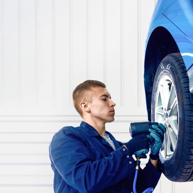 Mechanic changing a tire.