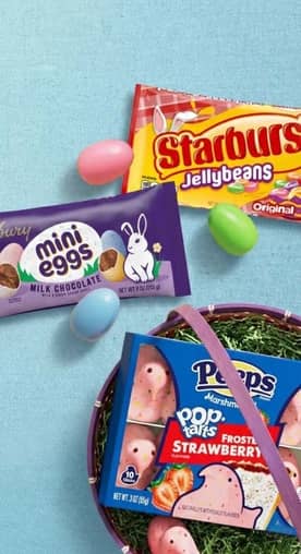 Starburst jellybeans are shown next to chocolate mini eggs and a box of Peeps and Strawberry Pop Tarts collab.
