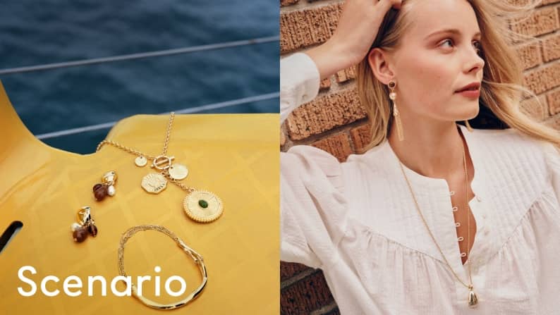 Gold necklaces, earrings and bracelets displayed beside a woman wearing a white blouse and coordinating gold jewelry.