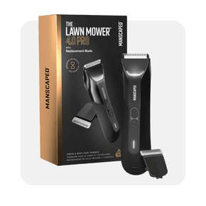 Image shows the Manscaped The Lawn Mower 4.0 Pro men's groin and body hair trimmer with an additional SkinSafe blade and packaging.