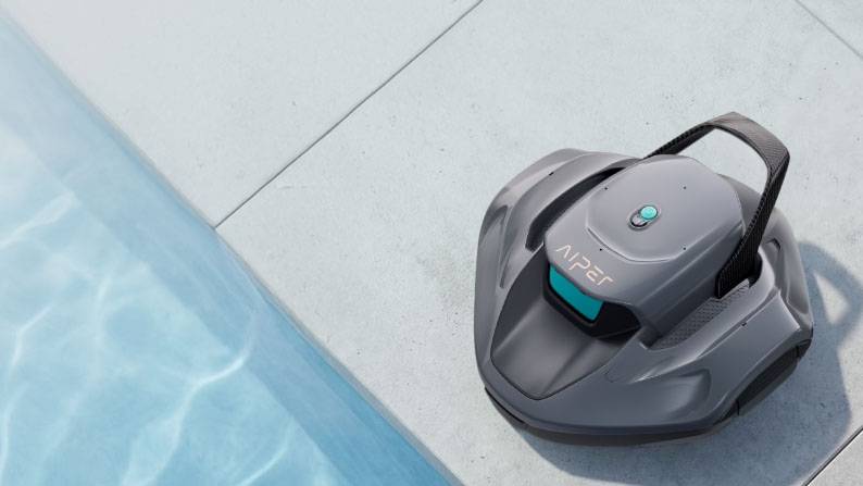 Aiper cordless robotic pool cleaner next to a swimming pool.