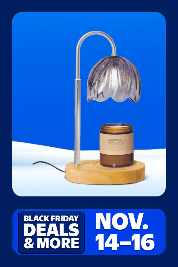 Image shows a silver and wooden BeePrincess candle warmer lamp with a purple glass shade on a blue background.