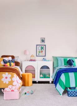 Two kids' beds with floral and striped bedding flank a white arched cabinet. Reads: Bedroom ideas. Must-haves from eight eighty-six.