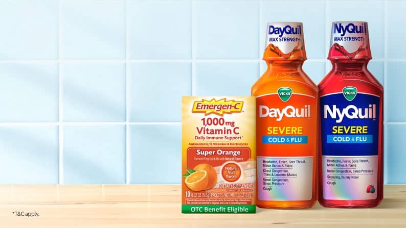 Image shows a box of Emergen-C Daily Immune Support & bottle of DayQuil & NyQuil Severe Cold & Flu on a countertop.