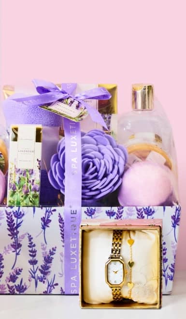 Gift set box including bath items and gift box including gold wristwatch and gold bracelet.