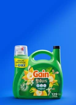 Gain Plus Original laundry detergent bottle with odor defense Oxi container, labeled for one hundred twenty nine loads.
