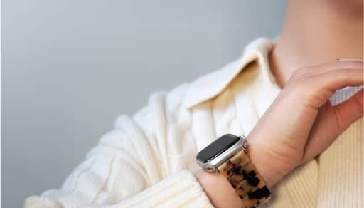 Apple Watch shown with tortoiseshell-style band.