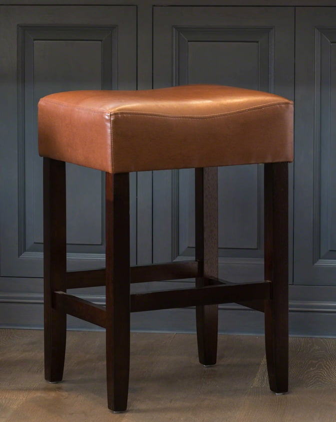 Bar Stool Ing Guide Com A Leather Bar Stool With Ebony Wood Legs Against Blue Paneled Wall Showcasing How To