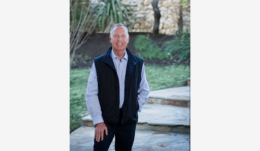 Max Lucado standing outside