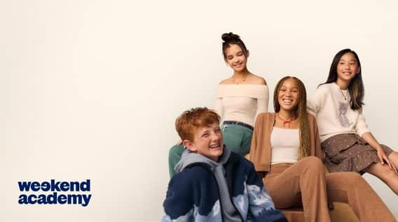 Four kids posing in casual fall fits, including a cardigan set, off-shoulder top with joggers, a printed skirt with sweater and a fleece jacket.