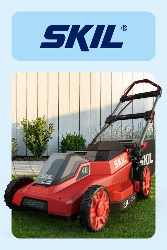 SKIL lawn mower in a yard.