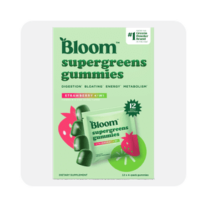 Image shows green and pink packaging of Bloom Nutrition Super Greens Gummies in strawberry kiwi flavor on a light green background.
