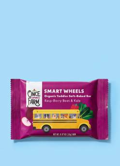 Once Upon a Farm Smart Wheels soft-baked bar in a purple wrapper with a school bus.