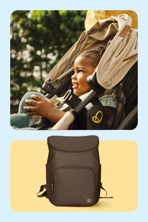A baby outside smiling in a stroller and a diaper bag on a yellow background.