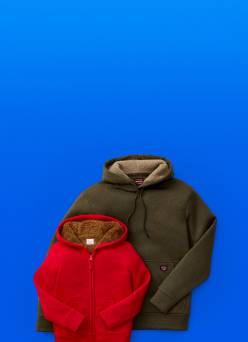 Image shows a brown fleece and a red fleece.