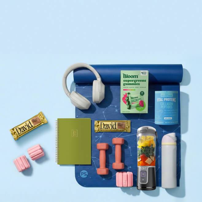 A yoga mat, headphones, Bloom supergreens gummies, Vital Proteins collagen peptide,  journal, weights, Ninja and sneakers.