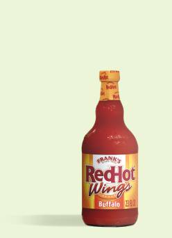 A bottle of Frank’s Red Hot Buffalo wing sauce is shown against a light green background.