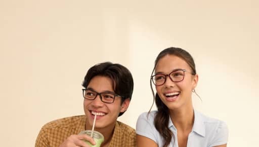 Two young adults wearing glasses.