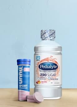 Pedialyte zero sugar and hydrating dissolvable tablets on a light blue background.