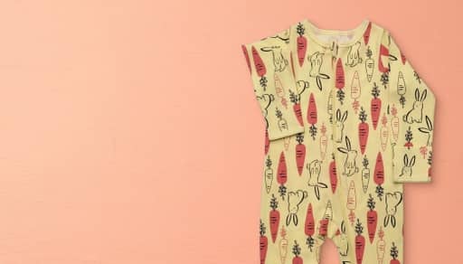 A carrot and bunny-printed infant jumpsuit.