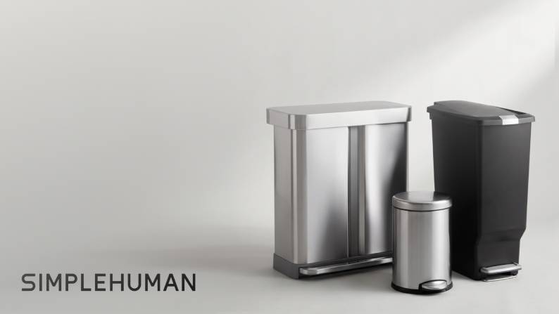 Simplehuman trash cans: two stainless steel pedal bins and one tall black pedal bin.