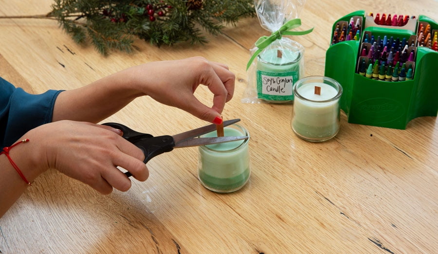 Trimming wood wick of homemade candle